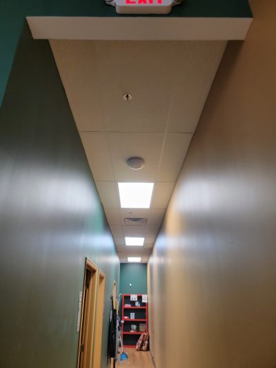 Lighting and tile replacement on a hallway ceiling